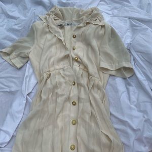 Cream tea length dress.